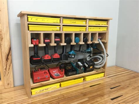 Cordless Tool Station and screw storage. This shelf holds 7-8 drills and 1 sander. I added a few ...