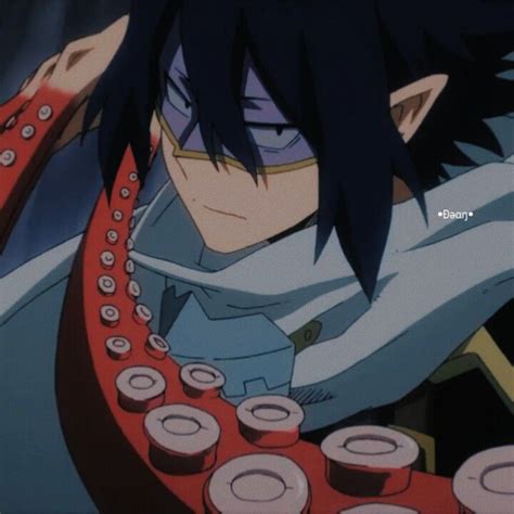 an anime character with black hair and blue eyes is typing on a red typewriter