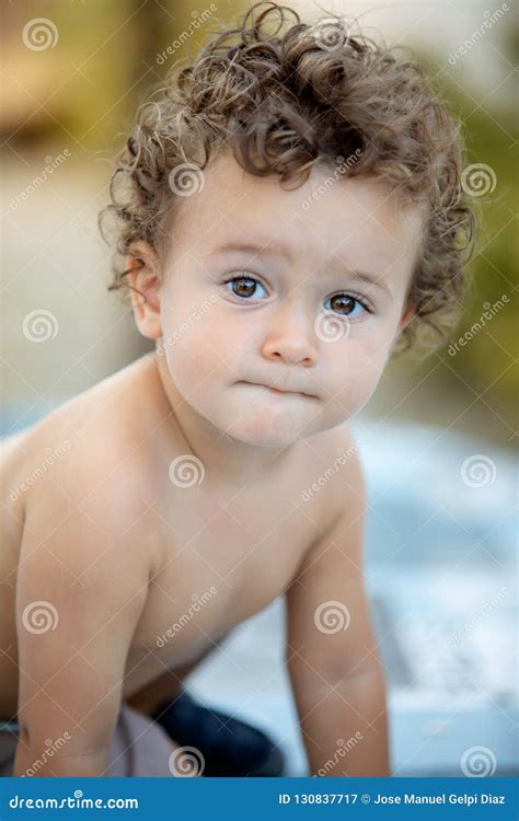 Beautiful Baby with Curly Hair in the Garden Stock Image - Image of little, child: 130837717