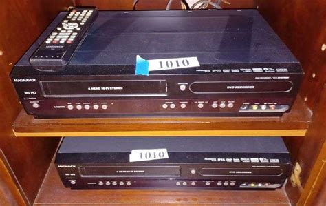 Two Magnavox dvd/vhs decks with one remote - Mark Van Hook, Auctioneer