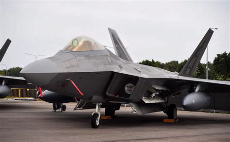 Watch the insanely powerful F-22 Raptor in action as it takes off at high speed with sonic booms.