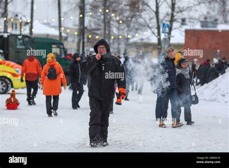 People walk down the street during the Independence Day parade at ...