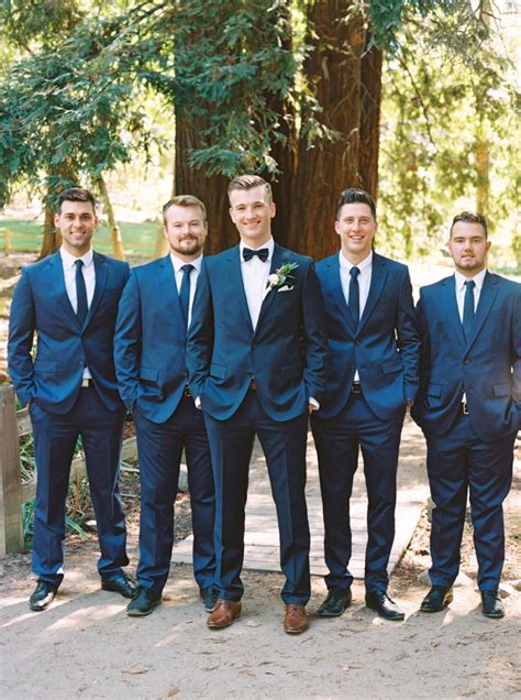 simple chic navy blue Hugo Boss suit paired with bow tie and brown leather shoes | great groom ...