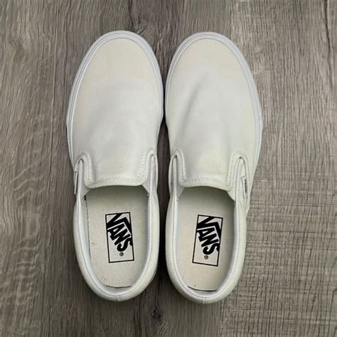 White slip on Vans.