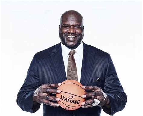 Shaq Holding Things