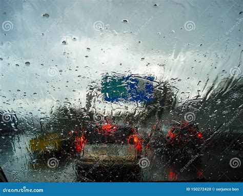 View of Road and Traffic Jams on a Rainy Day from Inside a Car with the ...