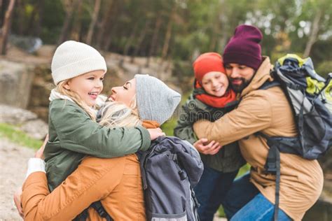 Parents hugging children stock photo. Image of parenthood - 103065580