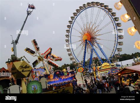 Ferris wheel and fun rides at the Oktoberfest, Munich, Bavaria, Germany, Europe Stock Photo - Alamy