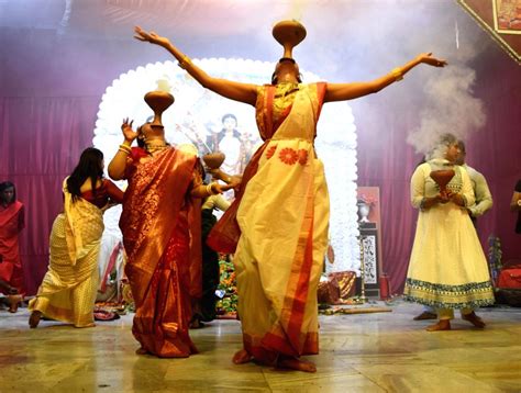 : Lucknow : Devotees performing Dhunuchi dance during Durga Puja celebration