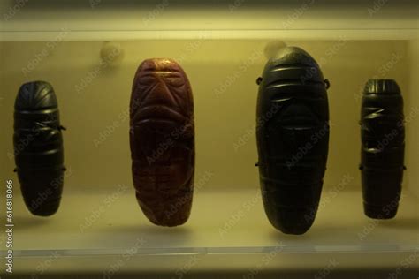 BOGOTA, COLOMBIA Closeup to a red an black carved gems of tairona culture into golden museum ...