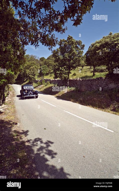 Vintage car on road Stock Photo - Alamy