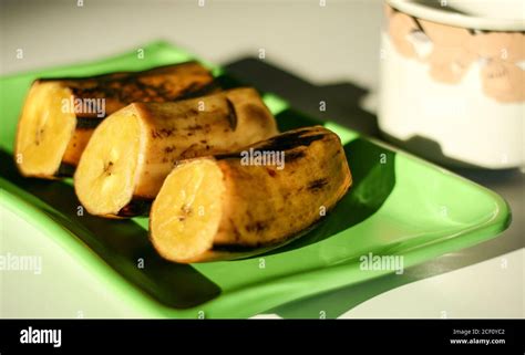 Boiled banana on white background Stock Photo - Alamy