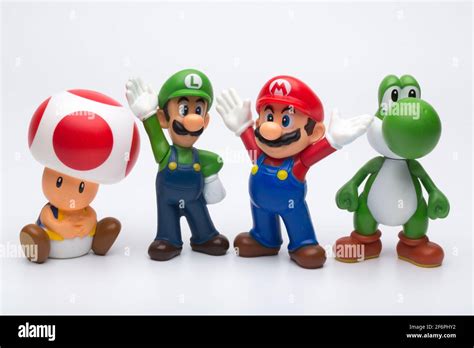 Moscow, Russia - April 06, 2021: Plastic figures of Mario, Luigi, Yoshi and Toad from Nintendo ...