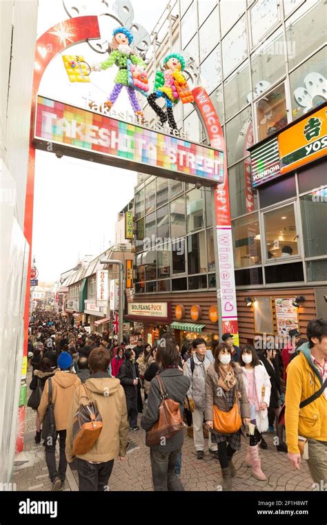 Crowds entering the gate over Takeshita Street, Takeshita Street is a ...