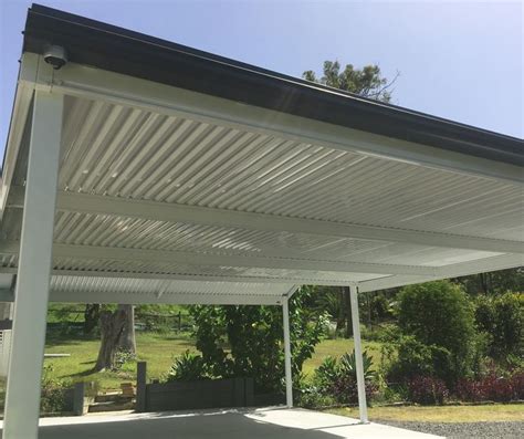 The carport is LYSAGHT SPANDEK® in COLORBOND® steel Surfmist®, with guttering and flashings in ...