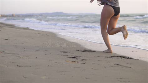 Female Running, Jogging Barefoot on Ocean Beach Sand at Sunrise Stock Photo - Image of people ...