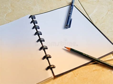 A Pencil and Drawing Pen on the Sketchbook Stock Image - Image of ...