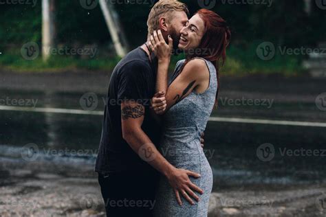 beautiful couple hugging in the rain 11487801 Stock Photo at Vecteezy