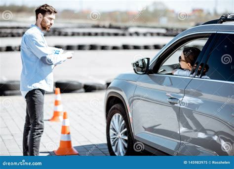 Instructor Teaching To Drive a Car on the Training Ground Stock Image - Image of showing ...