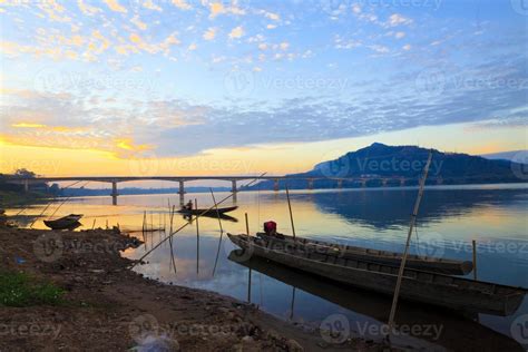 Fishing boats in the Mekong River 8531722 Stock Photo at Vecteezy