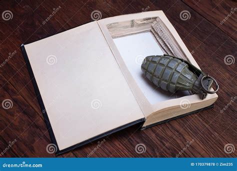 Hand Grenade Hidden in a Book Stock Photo - Image of blunderbuss, grenade: 170379878