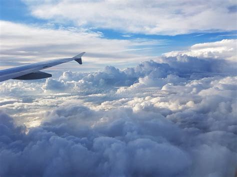 View from Plane Above Clouds Stock Photo - Image of sunlight, cumulus: 162279974