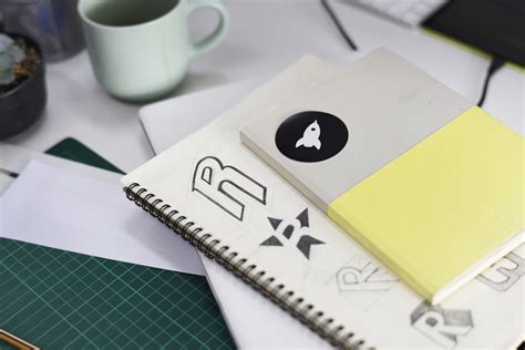 Notebook With Brand Logo Creative Design Ideas | Sagacity