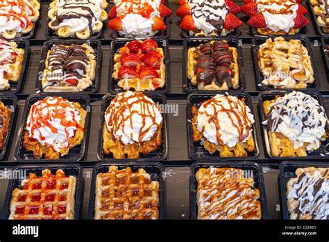 Belgian waffles with colorful toppings on showcase. Brussels Stock ...