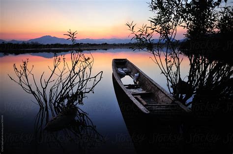 "The Boat In Mekong River." by Stocksy Contributor "Chalit Saphaphak" - Stocksy