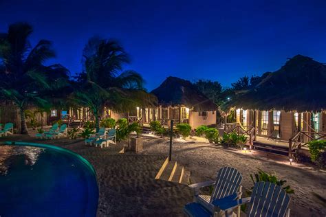 Sleep underneath a palapa roof at Portofino Beach Resort in Belize > Resorts, Hotels & Inns ...