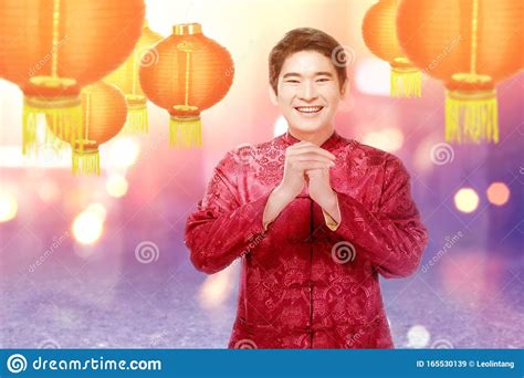 An Asian Chinese Man in a Cheongsam Dress with Congratulations Gesture Stock Image - Image of ...