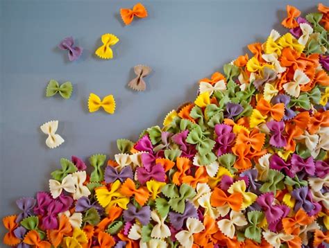 Premium Photo | Multicolored pasta in the shape of butterflies loose