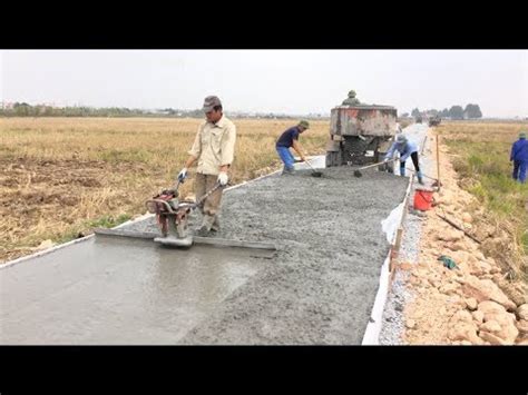 Construction A Concrete Road Stretching On Rural Fields With Ready-Mixed Concrete - YouTube