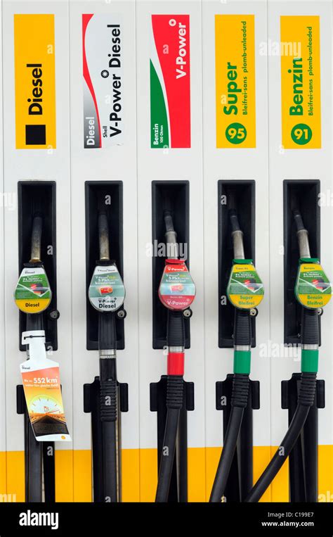 Petrol pump, nozzles of different types of petrol and diesel Stock Photo - Alamy