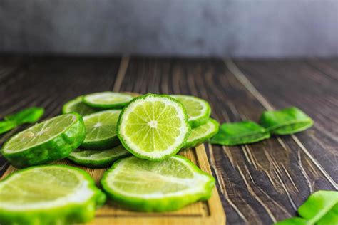 Fresh bergamot fruit slices on wooden 6667658 Stock Photo at Vecteezy