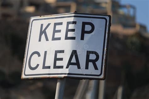 Keep Clear Road Sign in Blue Sky Background, Vertical. Stock Image - Image of white, rusty ...