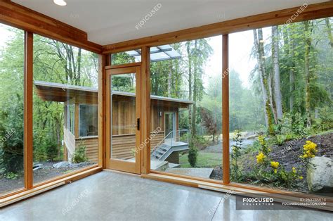 Glass windows of modern house in countryside forest — Domestic Life ...