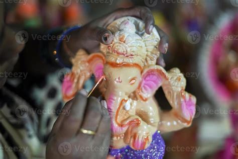 Artist making clay ganesh idol for ganesha festival - concpet of hindu ...