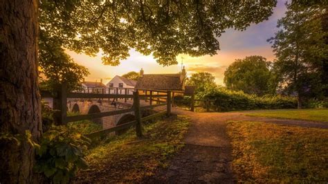 Premium Photo | A bridge in the park at sunset