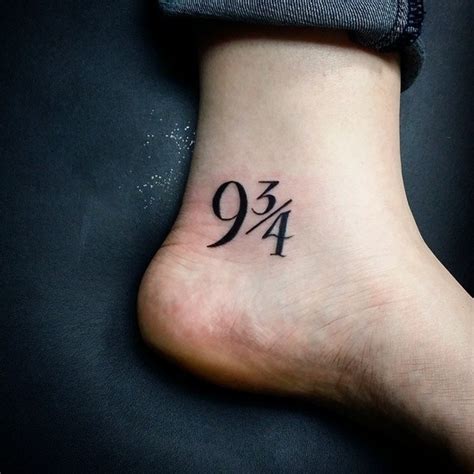 Symbolical numbers 9 3/4 tattoo on ankle in dark black ink ...