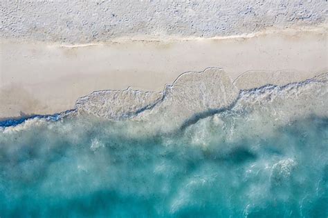 Aerial View Of Sandy Beach And Ocean Photograph by Levente Bodo - Fine Art America