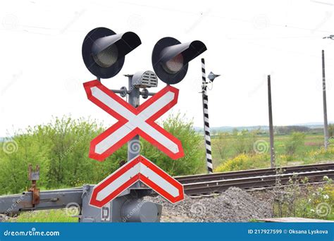 Railway Level Crossing with Semaphore and Barrier. Warning Road Sign on the Proximity of a ...