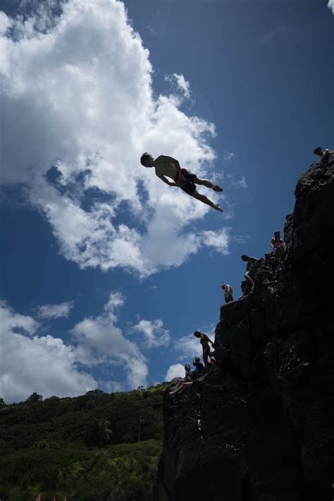 Man Diving From A Cliff · Free Stock Photo