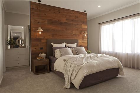 This statement wood panelled feature wall cleverly hides a generous walk in robe - stylish and ...