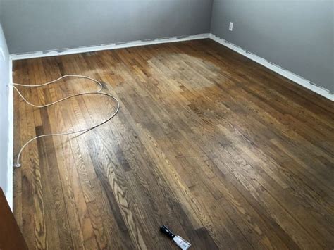 diy hardwood floor refinishing - before picture with water damage and the works. These babie ...