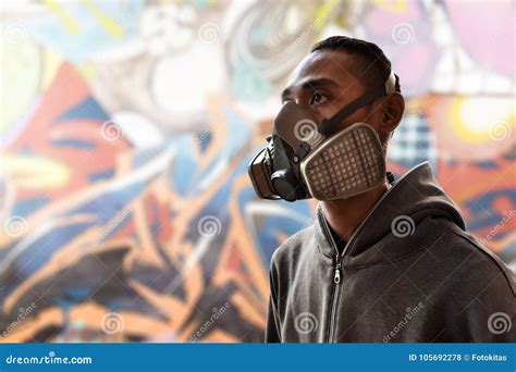 Graffiti Artist Wearing a Gas Mask Stock Photo - Image of outdoor, artwork: 105692278