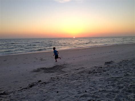 Benjamin running on the beach at sunset – Hazy Rain Tricks