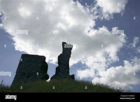 The silhouetted ruins of the castle keep Okehampton Castle Okehampton Devon Great Britain Stock ...