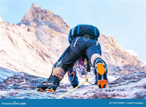 Climber Reaches the Summit of Mountain Peak. Climbing and Mountaineering Sport Concept Stock ...