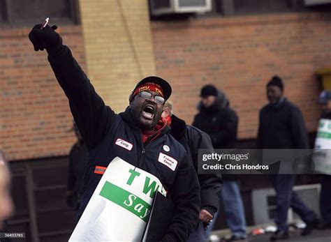 A worker leads strikers in slogans during a strike outside Triboro... News Photo - Getty Images